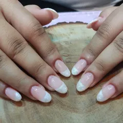 A new take on the French style. This design features a textured, pearly white tip that gives it a unique, almost crystalline finish.