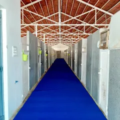 The blue carpet is rolled out for our VIP guests. This is the main corridor of our kennel block, kept spotlessly clean and ready for the busy season.