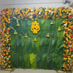 A clear, straight-on view of the banana leaf and floral backdrop. This versatile design is perfect for Haldi, baby showers, or any traditional pooja ceremony.