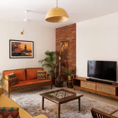 A complete living room setting featuring our Ramaniyam collection, which we created through a close collaboration with our client. This space showcases how we can customize an entire suite of furniture, including the sofa, center table, and TV unit, to reflect a client's personal story and cultural roots.