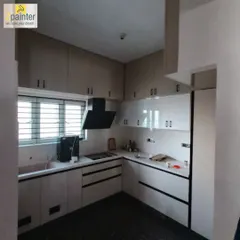 These kitchen cabinets were updated with a combination of light and glossy white paint. This approach brightens the space and gives it a clean, modern feel.