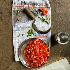 The simple, fresh ingredients for a traditional tomato chutney, prepared with a local sickle-shaped knife. We love learning and sharing these authentic recipes from the villages we visit.