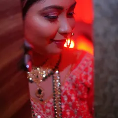 An artistic and creative bridal portrait using red lighting. I see bridal photography as fine art, focusing on mood and emotion to create a powerful and unique image.