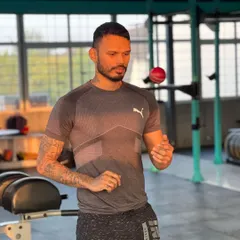 A quiet moment of focus in the gym. Hand-eye coordination and concentration are mental skills that are just as important to train as physical ones.