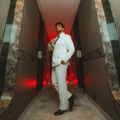 Actor Karan Kundrra in a full-length shot of the custom white double-breasted suit I designed. The clean lines and sharp tailoring create a commanding presence.