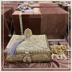 A brown velvet Rajwada Box paired with an elephant-shaped platter for sweets. This collection is the epitome of luxury bespoke gifting, designed for your most discerning clients.