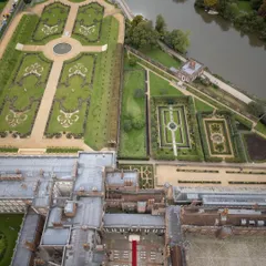 An aerial view of the historic Hampton Court Palace, where we set the stage for a royal Indian wedding in the English countryside. Our expertise in international wedding logistics allows us to transform iconic global venues into deeply personal celebrations.