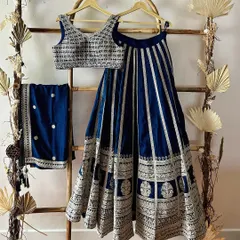 A classic navy blue and silver embroidered lehenga. This is a timeless piece that is perfect for a wedding reception or sangeet.