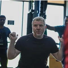 An instructor leads the opening session of the UKSCA ASCT course. Day 1 is dedicated to introductions, safety protocols, and the principles of foundational movement.