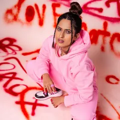 A different angle from our graffiti shoot, this time a crouching pose that adds to the edgy, hip-hop vibe. It shows how we can work with different poses to build a diverse and dynamic portfolio.