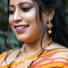 A happy, smiling wedding guest. I created a soft eye makeup look with a warm, rosy lipstick that enhances her natural smile.