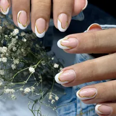 I love giving classics a modern twist. This is my abstract take on the French manicure, featuring a clean white tip with a sleek, liquid-gold chrome border on a natural nude base for a minimal yet bold statement.
