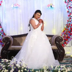 A beautiful Christian bride in her white wedding gown. I created a soft, romantic makeup look and an elegant hairstyle to complement her stunning dress for the reception.