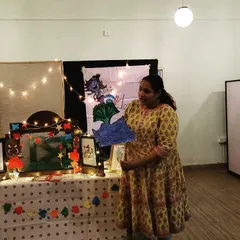 Holding up a prop of a big wave during a story. Using visual aids like these helps children, especially younger ones, visualize the setting and action of the tale.