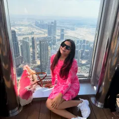 Sitting by the window at the Burj Khalifa, overlooking the stunning Dubai skyline. My comfortable dress and sneakers were perfect for a long day of exploring.