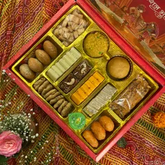 Another look at our customizable wedding Bhaji Box. This one features a mix of Besan Laddoo, Moong Dal Barfi, Kaju Katli, and savoury mathri, offering a complete taste of our traditional offerings.