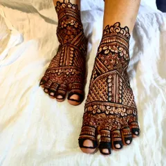 A full-coverage bridal foot design with dense, traditional Indian patterns.