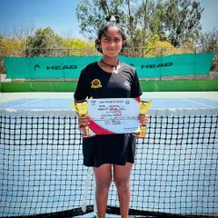 Eshitha with her double crown trophies after winning both singles and doubles at the SAT Sports TS-7 AITA Under 14.