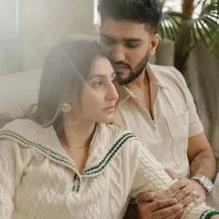 A pensive, gentle embrace. We use soft, hazy light to create a dreamy and romantic mood for our indoor couple photoshoots.