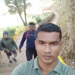 Our coach taking a moment during a strenuous outdoor training session at the international kickboxing camp. Stair climbing and running are essential parts of our conditioning program.
