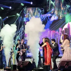 The couple and their friends take over the stage in a cloud of smoke. Our Sangeet setups are designed to be interactive and fun, with special effects that make everyone feel like a star.