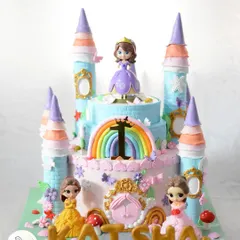 The full view of this magnificent princess castle cake, showcasing all the different princesses and whimsical details that make it so special.