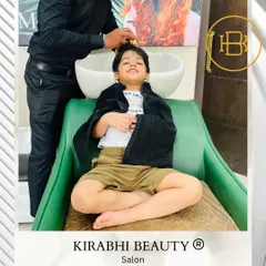 Yes, kids love our salon too. This little guy is relaxing and enjoying his hair wash before getting a smart new haircut.