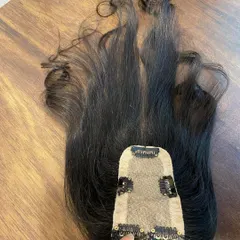 Here is the underside of a 2x5 silk base topper. You can see the secure clips that hold the piece gently but firmly in place without damaging your natural hair.