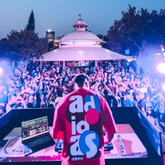 A view from behind the console at Wonderla for International Men's Day. The open-air setting with a massive, energetic crowd is an incredible sight.