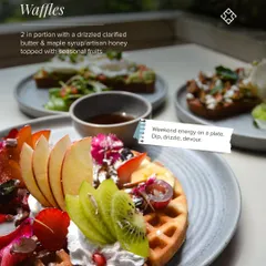 Weekend energy on a plate. Our classic waffles are served in a portion of two, topped with seasonal fresh fruits, whipped cream, and a side of maple syrup for dipping and drizzling.