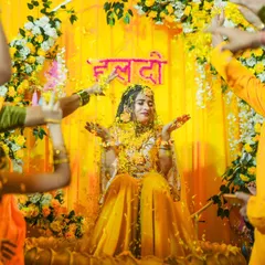 The bride is showered with flower petals during her Haldi ceremony, a moment of pure bliss and celebration. I love capturing these colorful, dynamic, and happy moments.