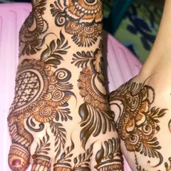A close-up of an intricate foot design. I love combining geometric patterns with flowing, leafy vines to create a design that is both structured and organic.