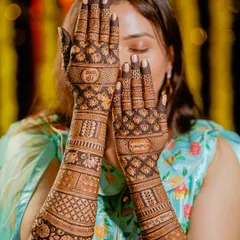 A detailed shot of the bride's intricate mehndi design. I believe in capturing the artistry and tradition that goes into every aspect of the wedding.