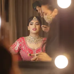 Adding the final touches for my beautiful bride Srishti. This mirror shot captures the magic of the getting-ready process.