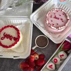 Our full Valentine's Day special spread. This includes our popular bento cakes, a box of white chocolate-coated strawberries that spell "LOVE", and a DIY box of fresh strawberries with a milk ganache dip.