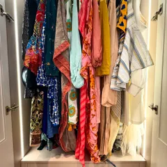 This closet section is dedicated to hanging colorful tops and dupattas, making them easy to see and choose from. The built-in lighting ensures no corner is left in the dark.
