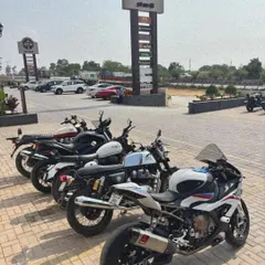 A lineup of superbikes parked near our brand pylon. This image captures the essence of a perfect rider's pitstop on a sunny day on NH44.