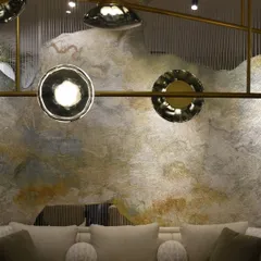 A detail of the Ceto chandelier at the India Art Fair. The fixture's organic, rippling glass forms provide a beautiful contrast to the raw, artistic texture of the wall behind it.