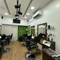 This wide shot shows the layout of my salon. It's a bright, open space with modern lighting and comfortable seating to ensure you feel at ease during your visit.