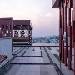 The terrace of this luxury apartment in Jubilee Hills is designed as a community space to unwind. The infinity pool is positioned to overlook the lake, creating a stunning visual effect.