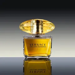 A classic hero shot of the Versace Yellow Diamond perfume. The lighting is designed to make the diamond-cut cap sparkle, and the reflection adds a touch of polished elegance.
