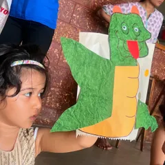 The pride on a child's face after they've created their very own puppet is just priceless. In our hands-on craft workshops, every child gets to design, build, and take home a new friend, like this amazing dragon puppet.