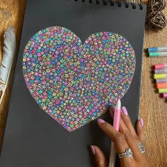 A heart filled with a thousand tiny flowers, a piece I created for Valentine's Day. You always gain by giving love.