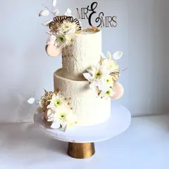 Another view of the textured white wedding cake. It's a timeless design that can be customized for weddings, engagements, or milestone anniversaries.