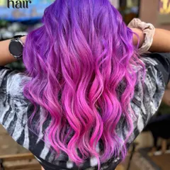 We're all about channeling that main character energy. This stunning purple to pink ombre melt was created using vivid hair colour for a look that's pure magic.