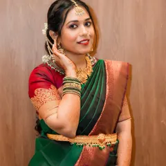 A close-up portrait of this beautiful bridesmaid. The makeup highlights her features with a focus on glowing skin and a warm, inviting smile.