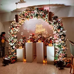 Here you can see the scale of the floral arch decoration. These lush, flower-heavy designs make a big impact and serve as a stunning photo backdrop for guests.