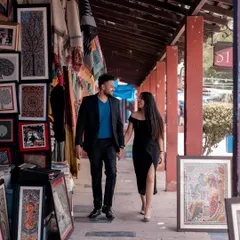 A stroll through a vibrant market, hand in hand. This type of city photoshoot captures the energy of your surroundings while keeping your connection at the center.