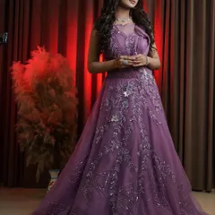 The way this gown is styled shows its versatility for different poses. The intricate silver work catches the light beautifully, adding a touch of sparkle that enhances any makeup look, especially for evening events.