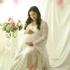 Adding a soft floral overlay to the frame enhances the dreamy, ethereal quality of this light and airy maternity portrait.